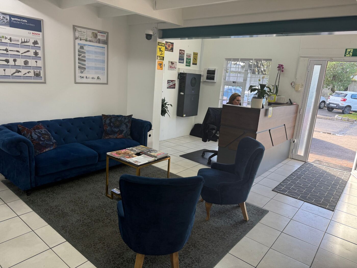 Atlantic Auto Clinic customer lounge with velvet sofas